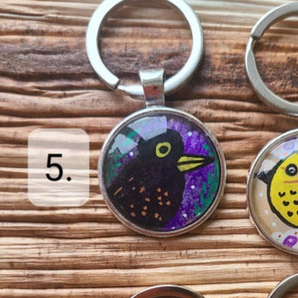 illustration of blackbird on key ring