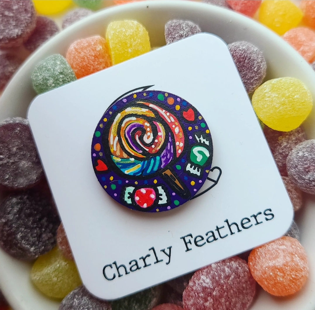 illustration lollipop on needle minder surrounded by sweets