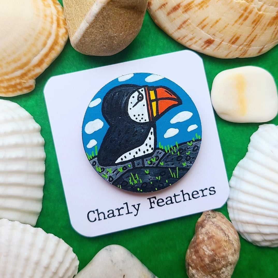 illustration of puffin on needle minder