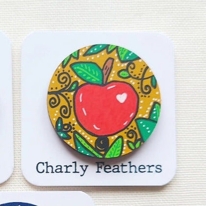 apple illustration on large needle minder
