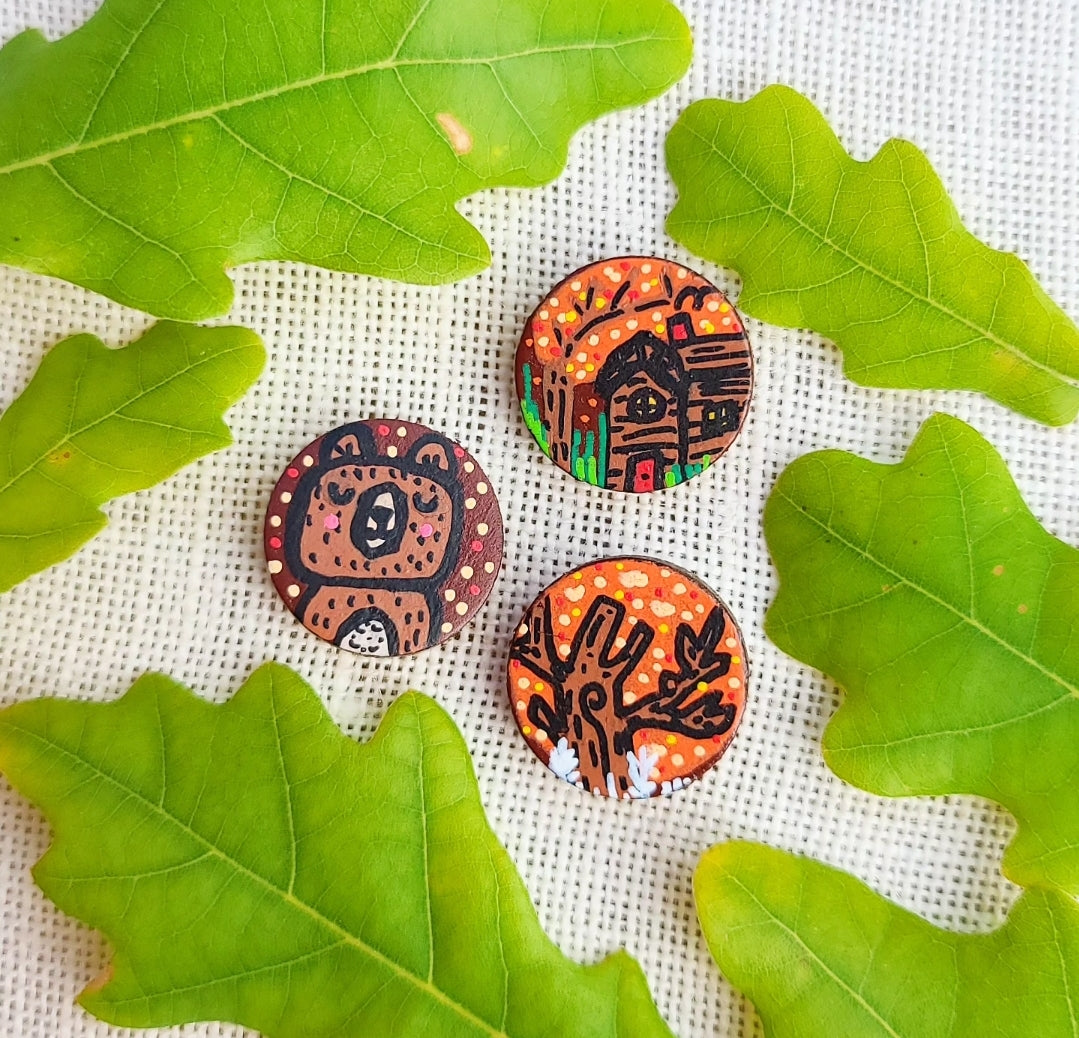 illustration of bear, cottage and tree on autumn themed mini needle minders