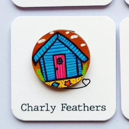 beach hut illustration on small needle minder