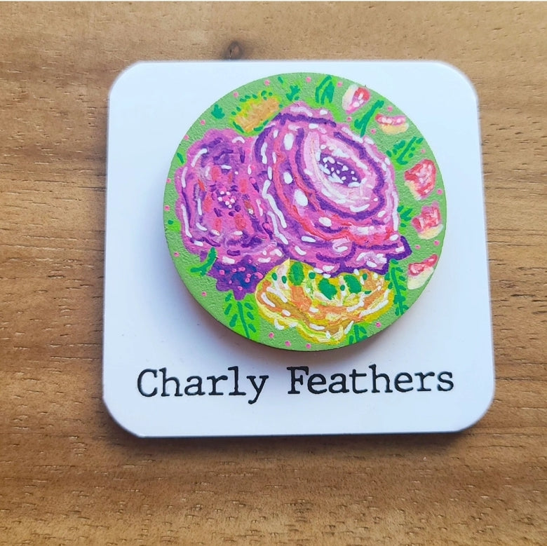 illustration of purple flowers on needle minder