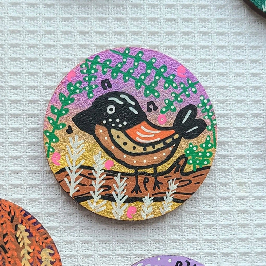illustration of bird singing on tree on needle minder