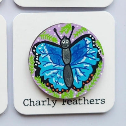 blue butterfly illustration on large needle minder