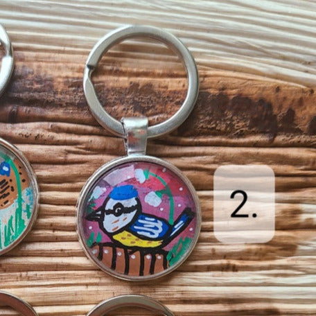 illustration of blue tit on key ring