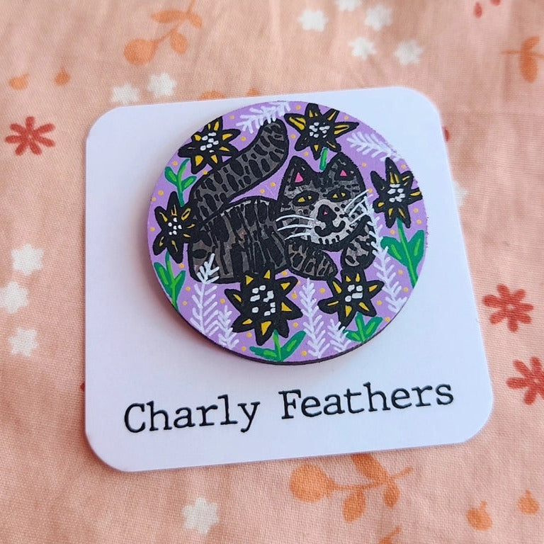 illustration of cat and flowers in large needle minder