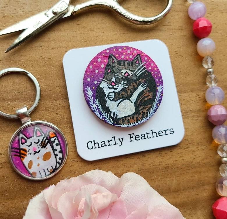 illustration of cats on key ring and needle minder