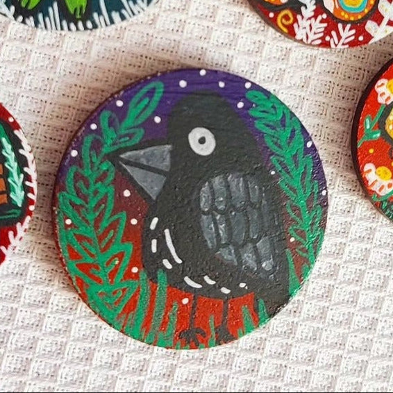 illustration of crow on needle minder