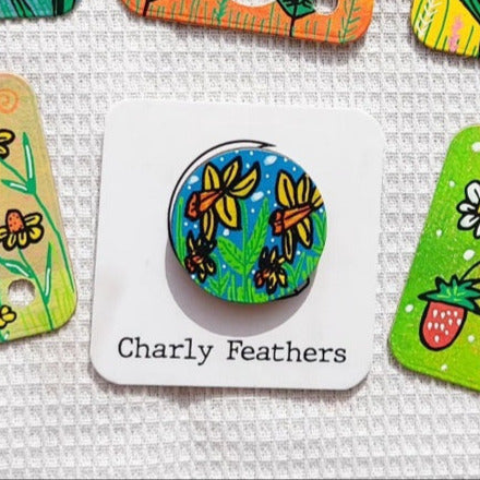 illustration of daffodils on small needle minder