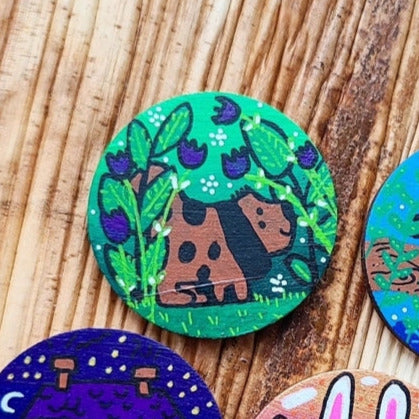 illustration of brown dog on large needle minder