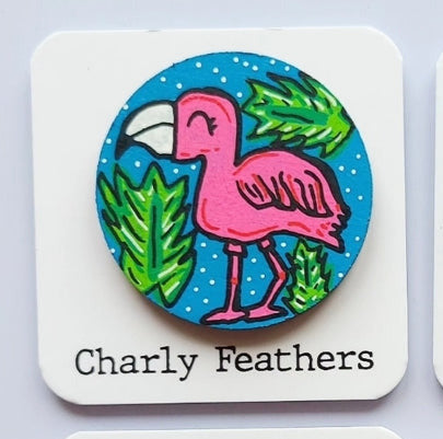  flamingo illustration on needle minder on cards with 'Charly Feathers' branding.