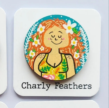 red headed girl illustration on large needle minder