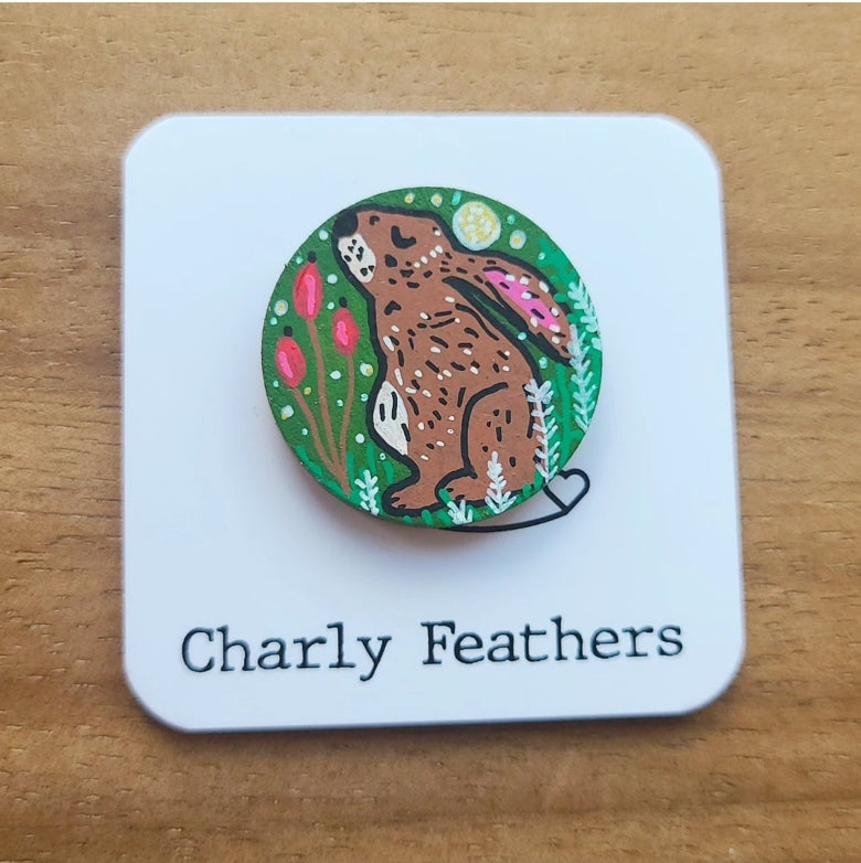 illustration of hare on green needle minder