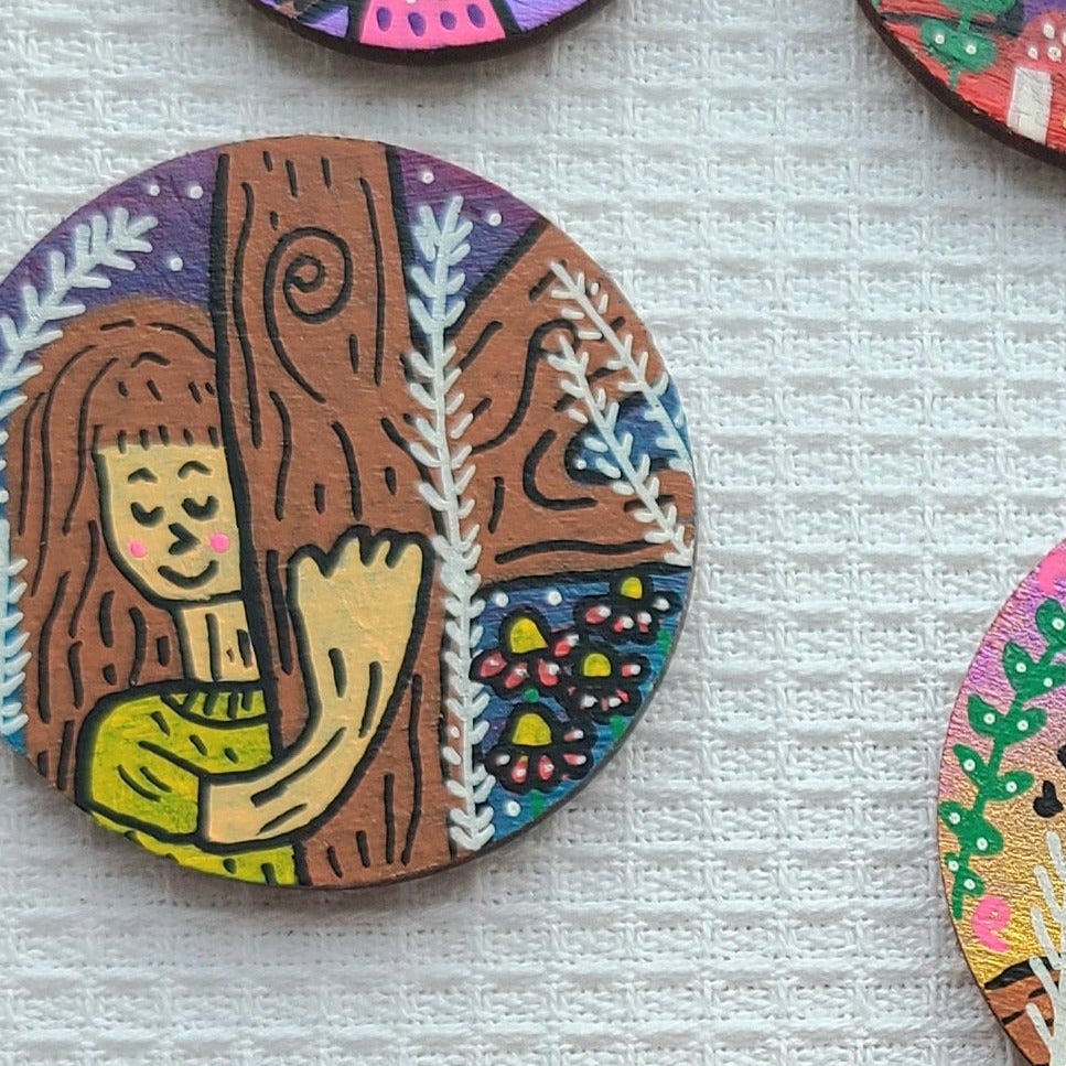illustration of girl hugging tree on needle minder