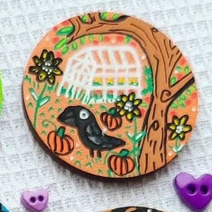 illustration of green house and bird on needle minder