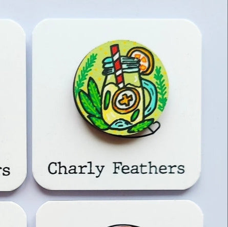 small needle minder by Charly Feathers with lemonade illustration on white cards with a light gray background.