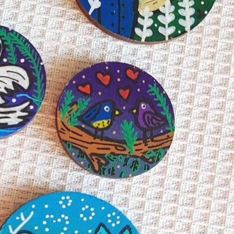 illustration of love birds at night on small needle minder