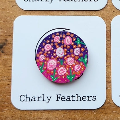 Floral design needle minder on a card with 'Charly Feathers' branding.
