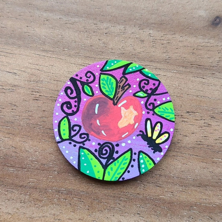 illustration of apple on pink needle minder