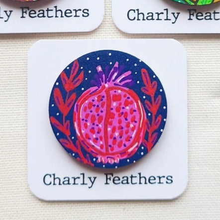 colorful needle minder pomegranate design on cards labeled 'Charly Feathers'.