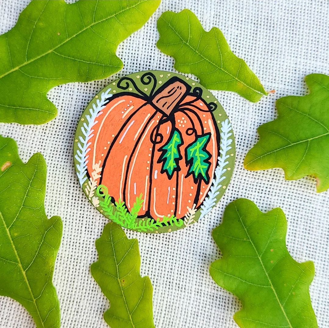 hand painted illustration of pumpkin on large needle minder