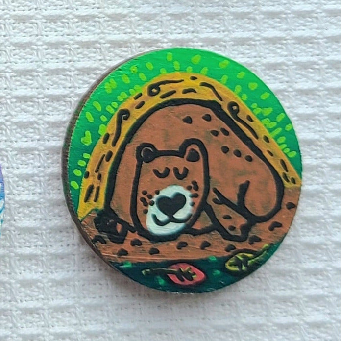 illustration of sleeping bear on needle minder