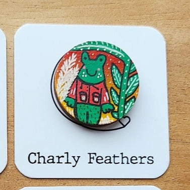 frog illustration on small round needleminder