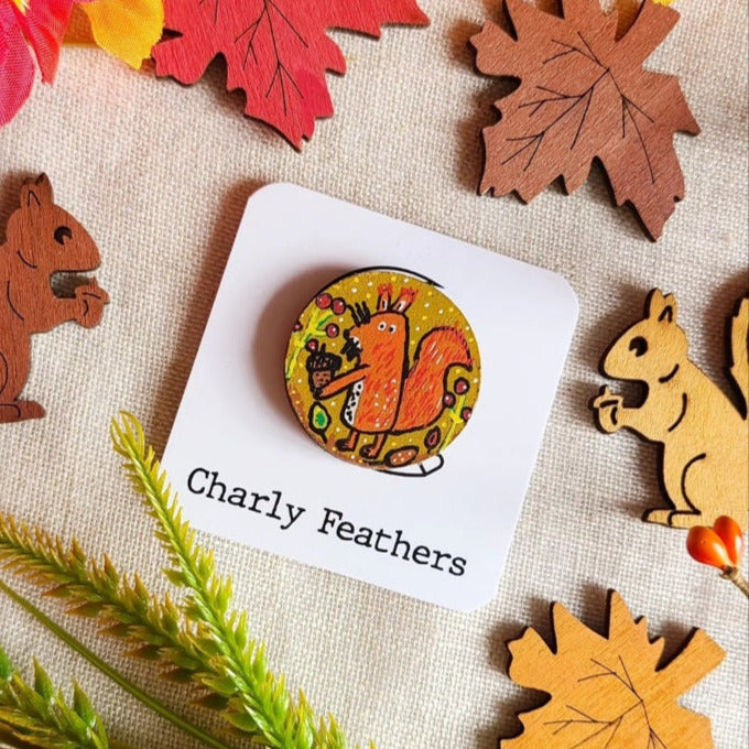 illustration of squirrel on small needle minder