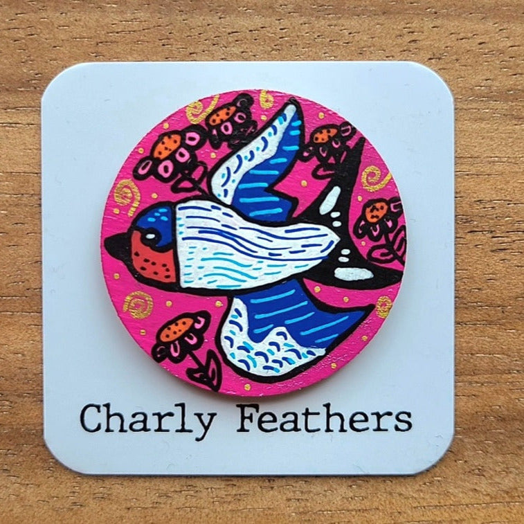swallow illustration on large pink needle minder