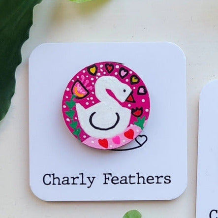 swan illustration on small needle minder