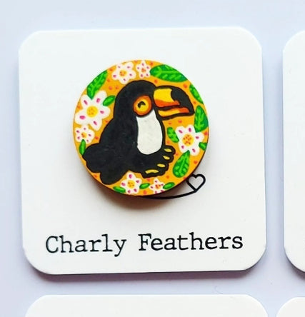 toucan illustration on small needle minder