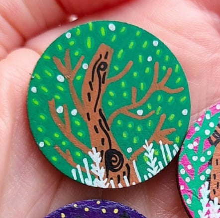 tree illustration on small needle minder