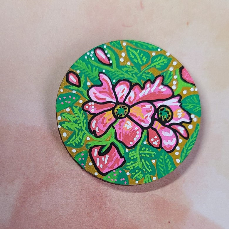illustration of wild rose on needle minder